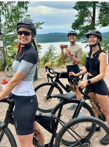Riders stopped by a lake outside Oslo